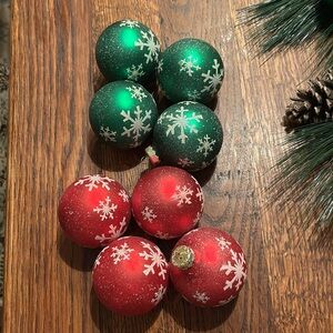 Eight Glass Christmas Ornaments 
Four Red/Four Green 
White Snowflake Designs